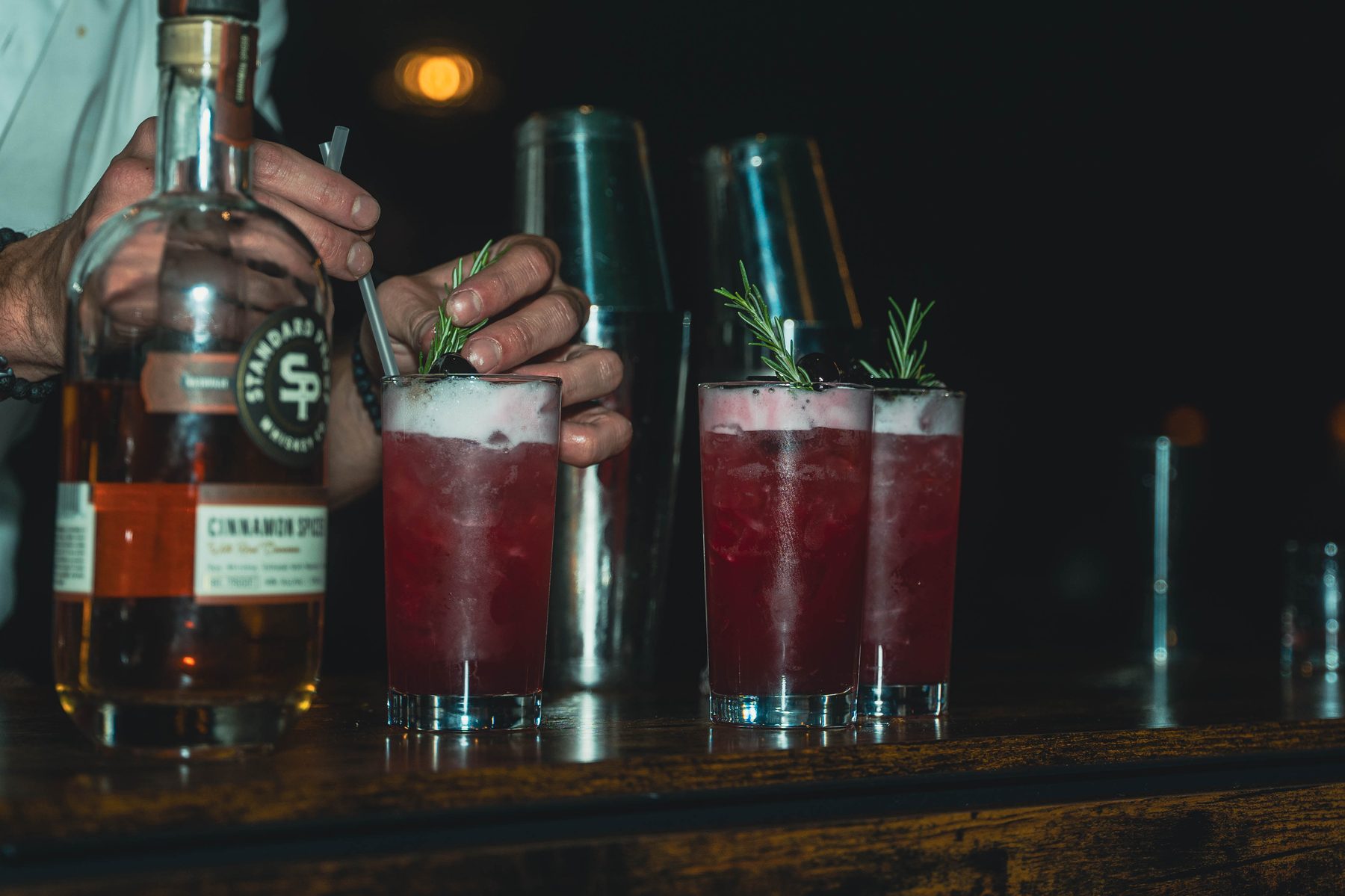 Rosemary-garnished cocktails ready to serve