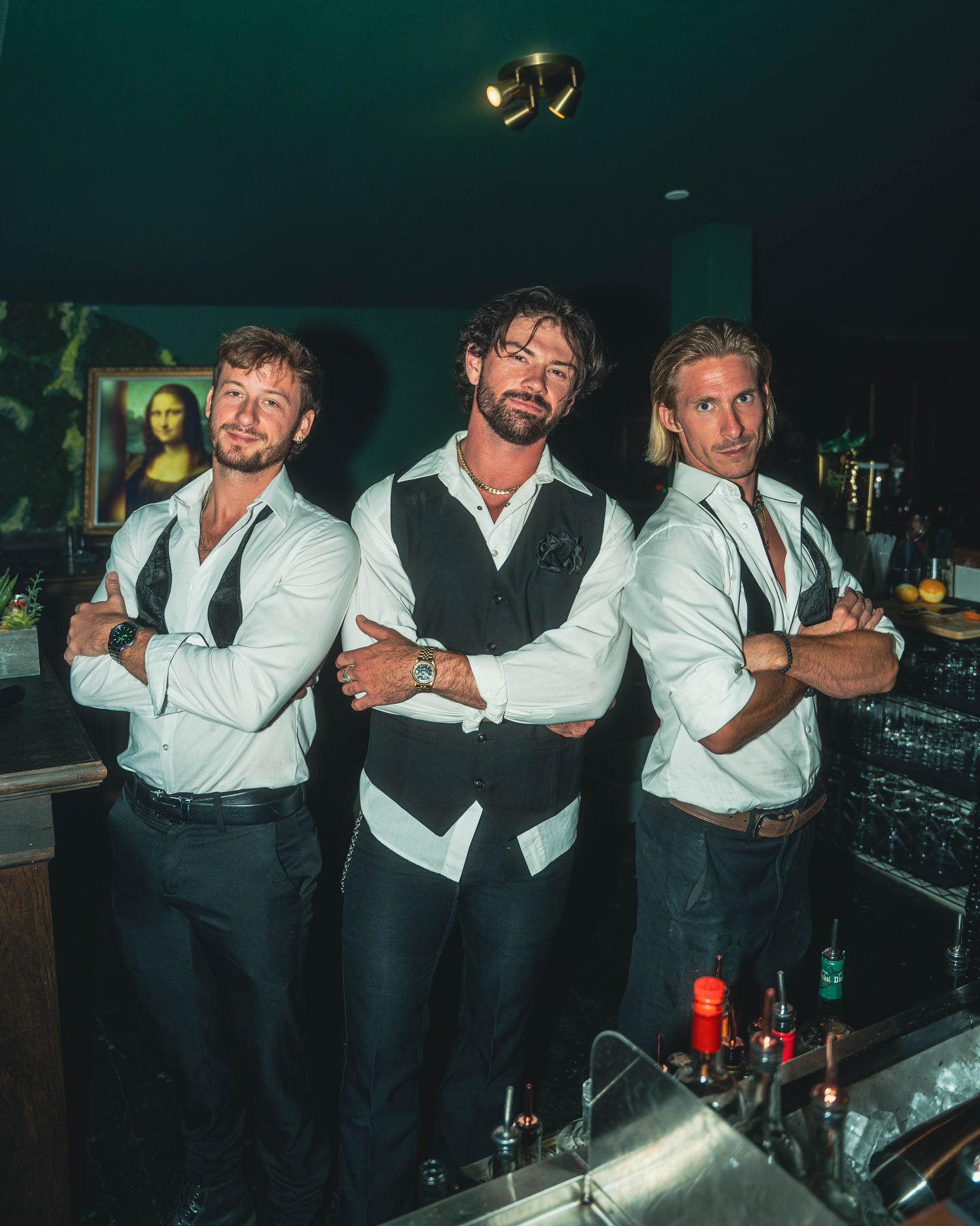 The FLAIR team — Jonah, Thomas, and Christian — behind the bar